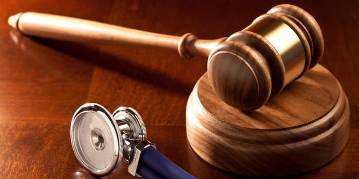Image of a doctor's stethoscope and a judge's gavel