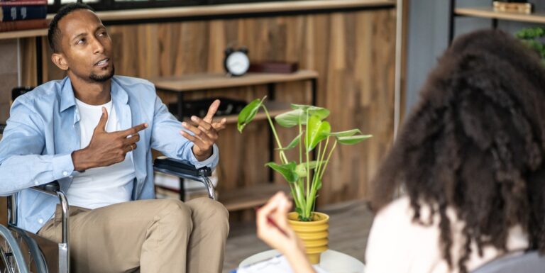 Image of a man speaking to a therapist